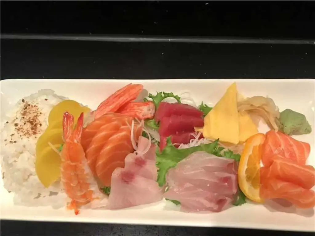 Mixed Sashimi Platter features an assortment of thinly sliced raw fish, such as salmon at Blue Wazabi, a Japanese restaurant in NJ