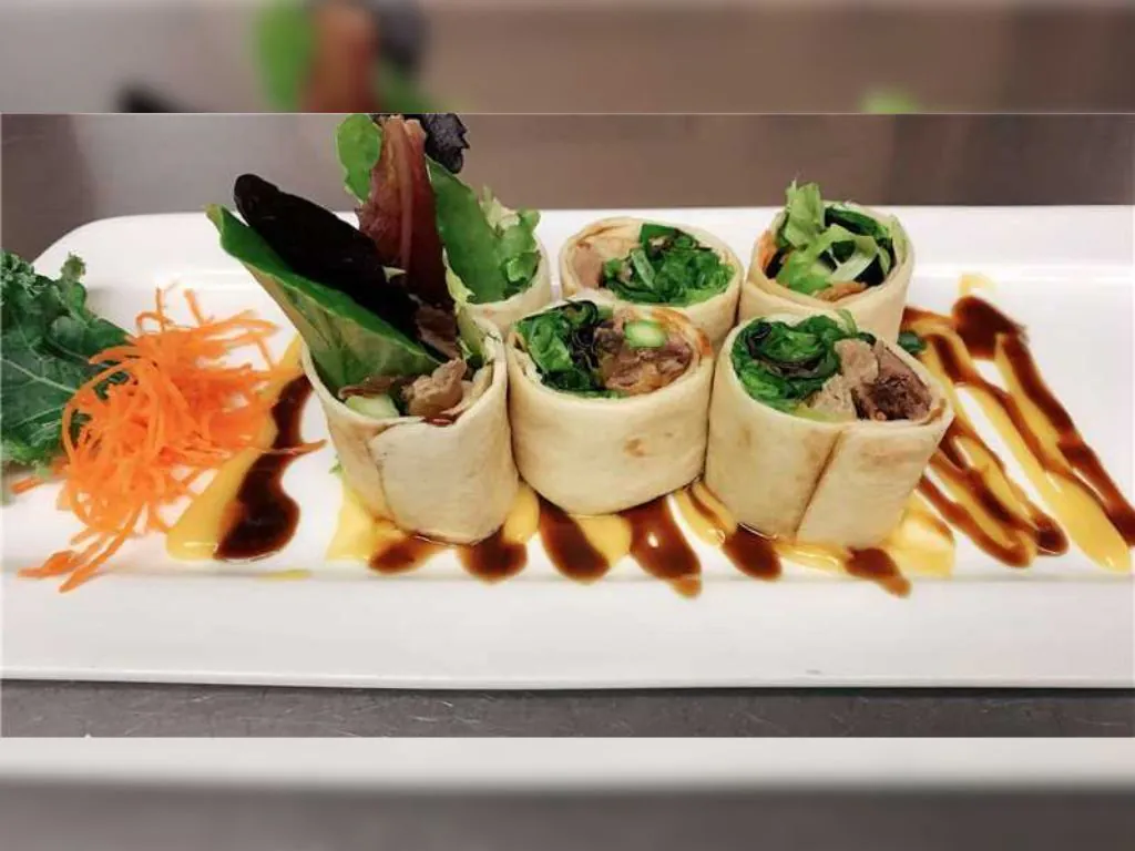 Lettuce and Meat Rolls are wraps made with soft tortillas, filled with fresh lettuce and pieces of meat at Blue Wazabi, a Japanese restaurant in NJ