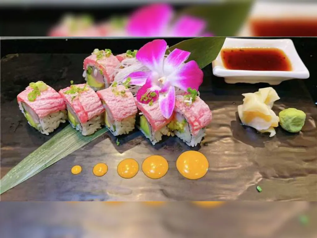 Salmon and Avocado Sushi Roll is crafted with vinegared rice, slices of fresh salmon at Blue Wazabi, a Japanese restaurant in NJ