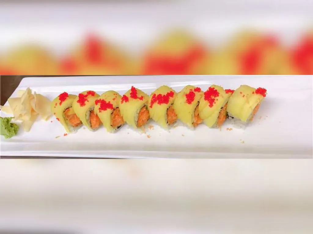 Salmon and Egg Sushi Roll consists of vinegared rice, fresh salmon, and layers of tamagoyakiat Blue Wazabi, a Japanese restaurant in NJ